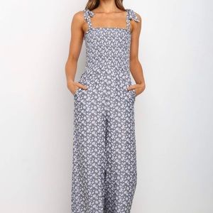 Jumpsuit with toe straps and scalloped bottoms